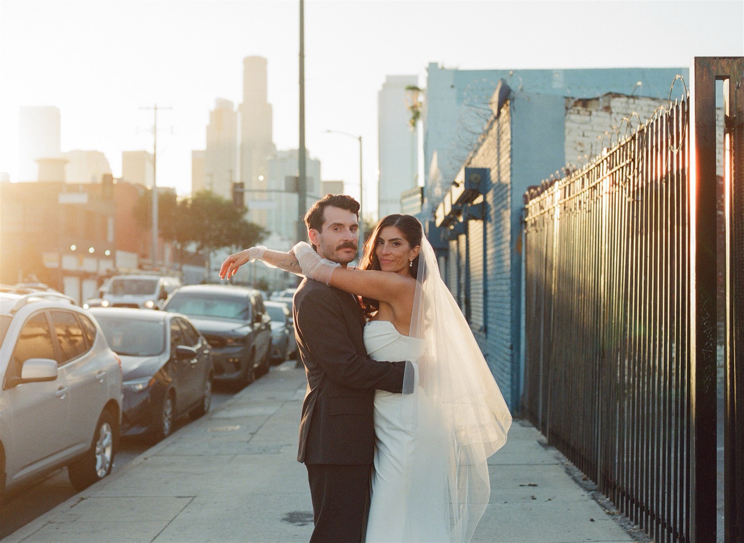 newlywed couples portraits taken during golden hour in Downtown Los Angeles