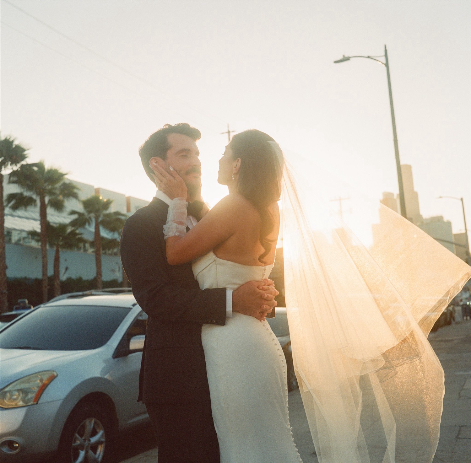 newlywed couples portraits taken during golden hour in Downtown Los Angeles